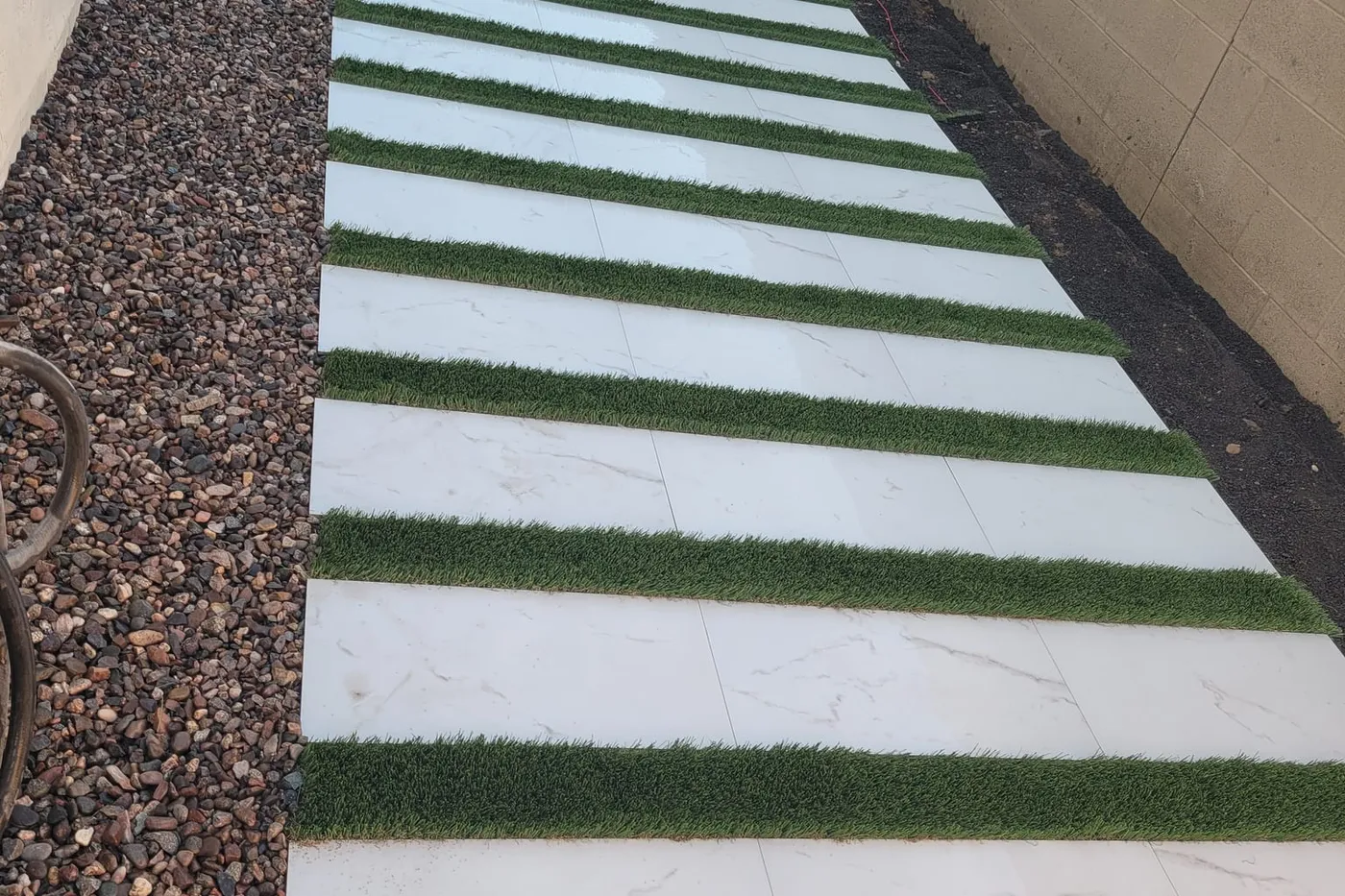 Stone slab steps set between strips of turf
